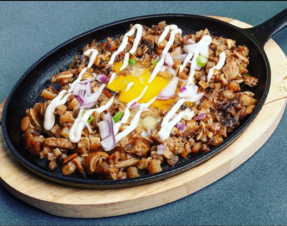 Sisig at Jav's Kaldero Surrey BC - Sizzling pork belly and face with onions, chili peppers, and calamansi